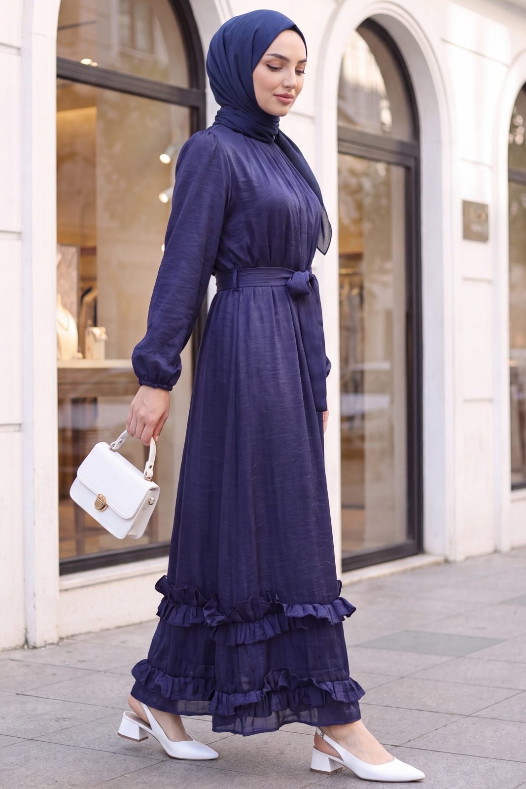 Long dress with ruffled neck and hem, elasticated sleeves, crinkle crepe lining. -Navy